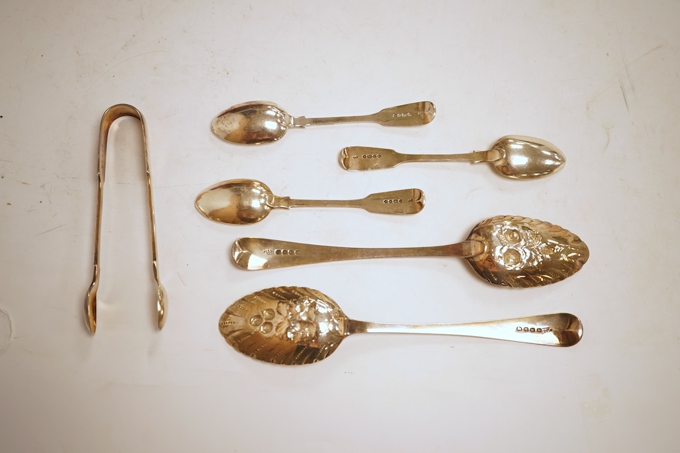 A pair of George III silver Old English pattern berry spoons, by Eley, Fearn & Chawner, London, 1810, 22.1cm, together with three Victorian silver fiddle pattern teaspoons, 6.8oz, together with a pair of plated sugar ton
